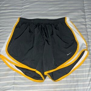 NIKE gray tempo shorts with yellow trim, medium